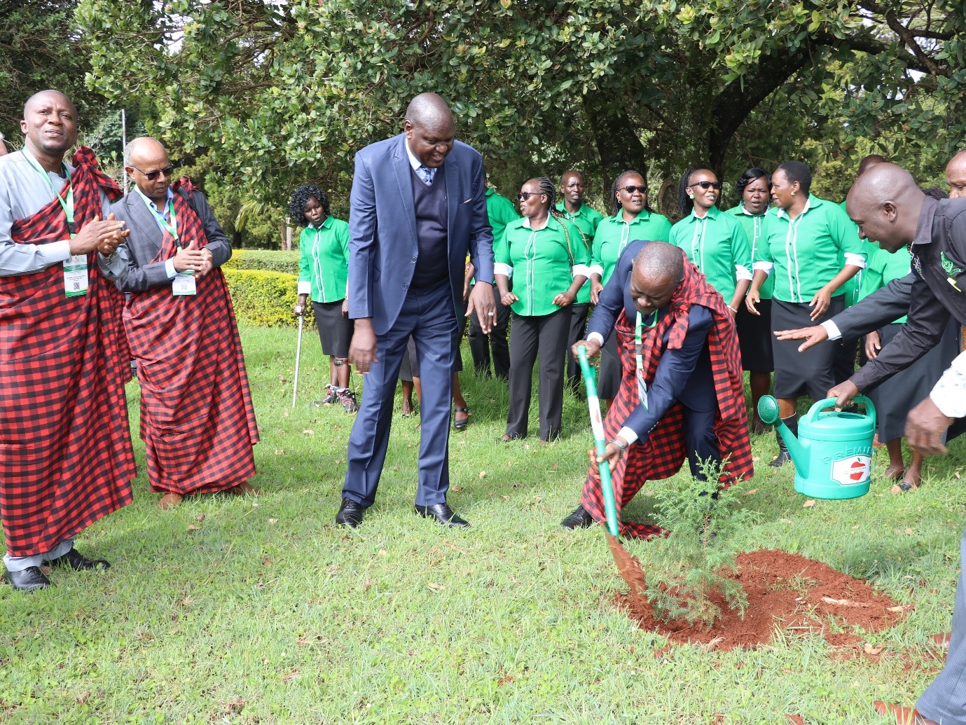 The Deputy Vice Chancellor (PF & A ), Prof. Amandus Muhairwa planting a tree.
