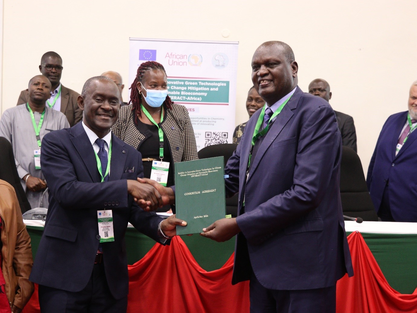 The Deputy Vice-Chancellor (PF & A) Prof. Amandus Muhairwa receiving the signed agreement from the Vice-Chancellor of MU Prof.  Isaac Kimengi.