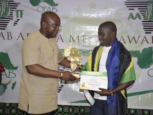 Mr Calvin Edward Gwabara (Right) Receiving OFAB 2018 Journalist of the Year from Hon. Remy Dandjinou (Left) the Burkina Faso Minister for Communication who was the guest of honor 