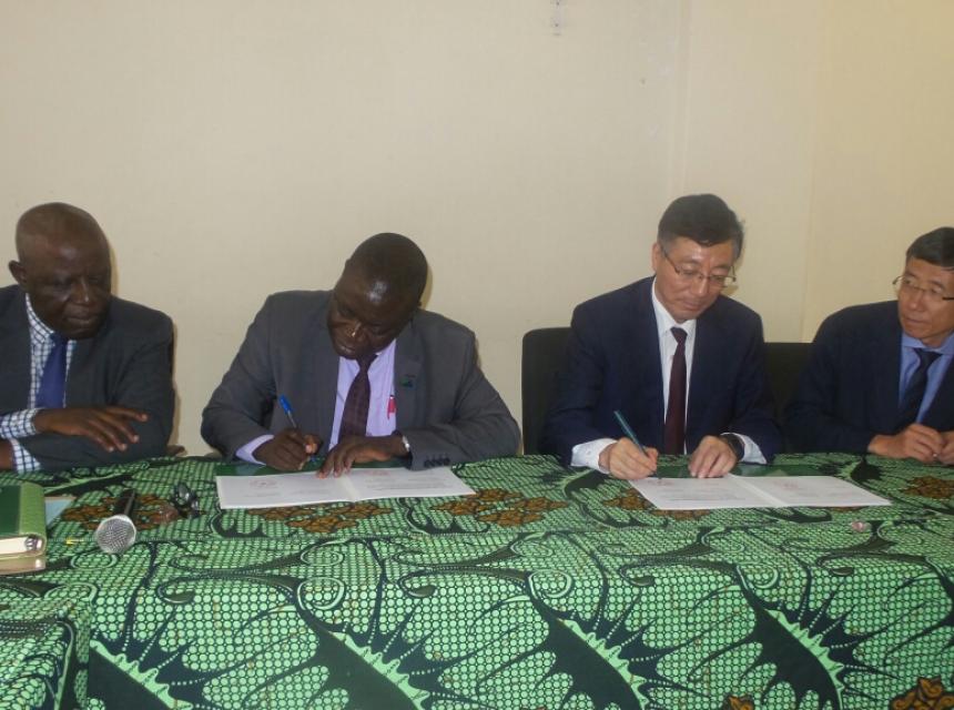 Sokoine University of Agriculture (SUA) Vice Chancellor Prof. Raphael Chibunda (Second left) and the President of China Agricultural University Prof. SUN QIXIN signing partnership agreement between the two universities